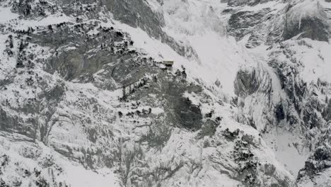 Drone-Aerial-view-of-the-snowy-Grindelwald-and-the-Eiger-in-the-beautiful-swiss-mountain-landscape