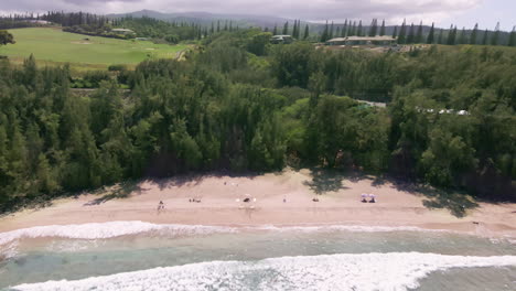 Aerial-view-of-Slaughterhouse-Beach-washed-by-calm-wave-of-turquoise-ocean,-Maui