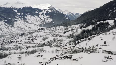 Drone-Aerial-view-of-the-snowy-Grindelwald-and-the-Eiger-in-the-beautiful-swiss-mountain-landscape