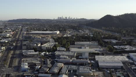 Aerial-view-over-Downtown-Los-Angeles,-Glendale-skyline-city-suburban-landscape-dolly-right