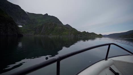 Front-view-from-a-boat-through-a-mountain-lake-in-Norway---Wide