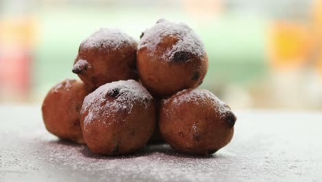 Yummy-homemade-small-Dutch-oil-balls-delicacy-with-sugar-powder-traditionally-eaten-on-New-Year's-Eve-in-The-Netherlands