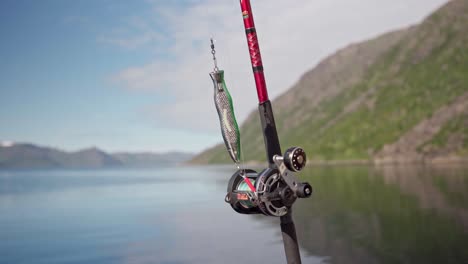 Fishing-Tackle-With-Spinning-Rod-And-Lures-On-A-Bright-Day-Background-In-Norway---Close-up-Shot