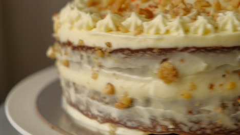 Close-Up-Of-Rotating-Carrot-Walnut-Cake-Covered-In-Cream