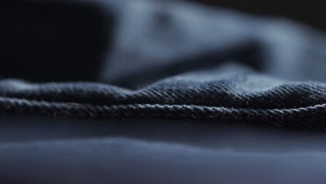 Closeup-Shot-Of-Seam-In-Blue-Denim-Fabric-During-Manufacturing-Process-Of-Designer-Clothing