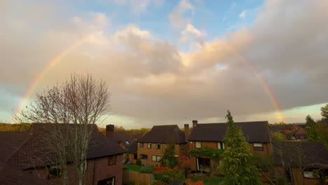 Wide-shot:-rainbow-over-English-suburban-town-houses