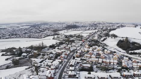 Aerial-view-of-Hemingfield-in-Yorkshire-covered-in-snow-on-a-misty-morning
