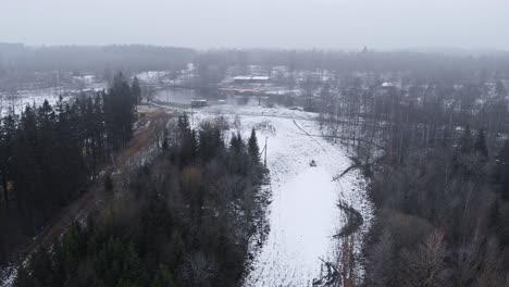 Drone-shot-of-ski-resort-in-Sweden-with-little-snowfall-mid-winter