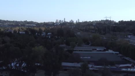 Rising-aerial,-downtown-Los-Angeles-over-Atwater-Village-durning-clear-day