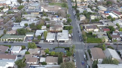 Aerial-over-At-Water-Village-in-Los-Angeles,-house-and-businesses-during-the-day