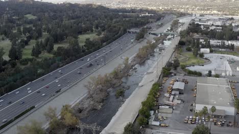 Los-Angeles-freeway-through-downtown-Atwater-Village,-aerial-view