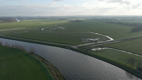 Aerial-of-beautiful-Dutch-landscape-in-Rural-Holland-with-a-river