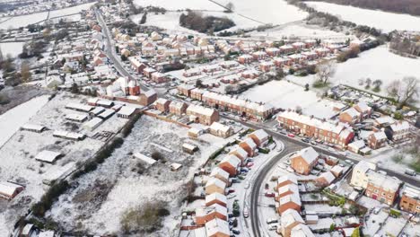 Aerial-footage-of-Hemingfield-village-in-Barnsley,-Yorkshire-after-a-snowfall