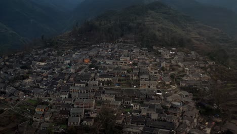 Ancient-Chinese-village-on-the-shadow-side-of-the-mountain-in-the-evening