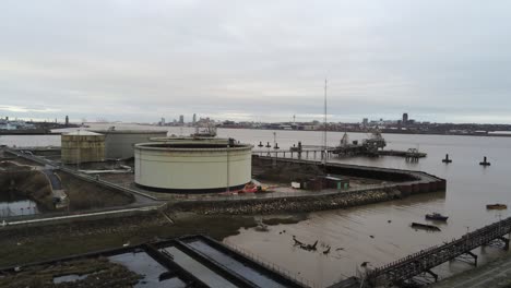 Drone-view-Tranmere-oil-terminal-Birkenhead-coastal-petrochemical-harbour-distribution-rising-across-shipping-refinery