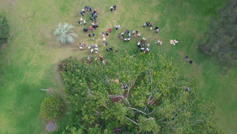 Guests-And-Visitors-At-A-Wedding-Ceremony-In-A-Beautiful-Garden-Reception-In-Wollongong,-Australia---aerial-top-down