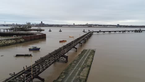 Drone-view-Tranmere-oil-terminal-Birkenhead-coastal-petrochemical-harbour-distribution-pull-back-over-docks
