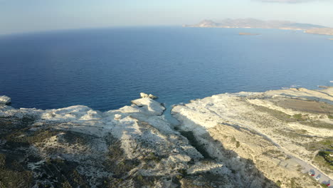 High-Cinematic-Aerial-Drone-footage-of-Sarakiniko-Beach-in-Milos-Island,-Greece-at-sunset-in-4K