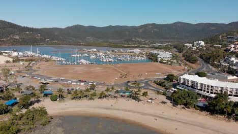 Aerial-view-of-Airlie-Beach-marina-and-coast,-resort-town-in-Australia