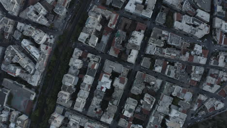 Slow-turning-topdown-shot-of-the-Athens-city-looking-down-on-buildings,-Greece