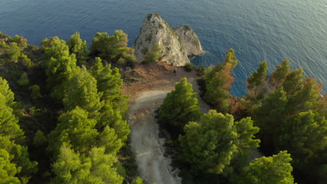 Drone-aerial-shot-moving-forward-reveal-shot-over-Kerri-Cliffs-with-blue-crystal-clear-water-below-on-the-greek-island-of-Zakynthos-in-4k