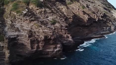 Drone-aerial-cliffside-Hawaii-beach-front-water-ocean