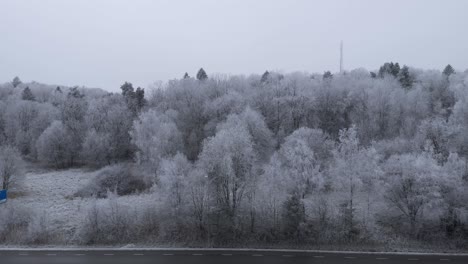 Winter-Scene-and-Black-Asphalt-Highway-Road-in-Gothenburg,-Sweden---Aerial