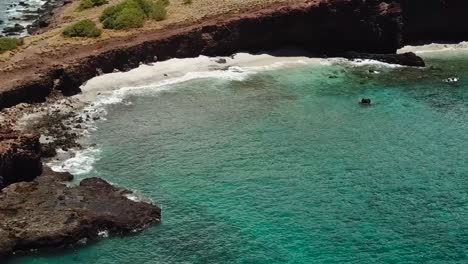 Drone-aerial-cliffside-beach-hawaii-water