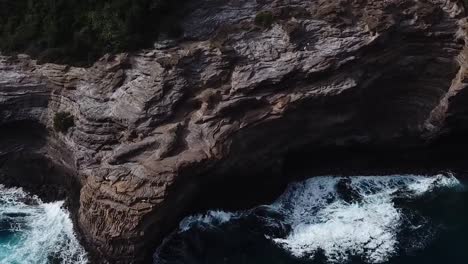 Drone-aerial-beachfront-cliff-side-Hawaii