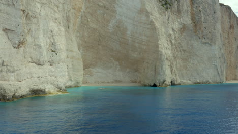 A-secluded,-deserted-beach-with-huge-white-cliffs-near-navagio-beach-in-Zakynthos,-Greece