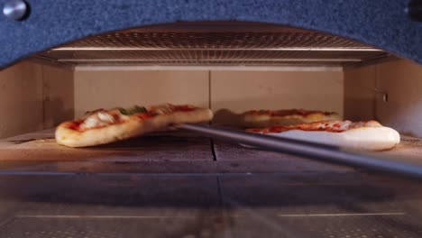 Time-lapse-of-four-pizzas-dough-rising-during-baking-simultaneously-inside-pizza-oven