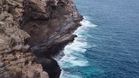 Drone-aerial-cliffside-Hawaii-waves-on-rocks