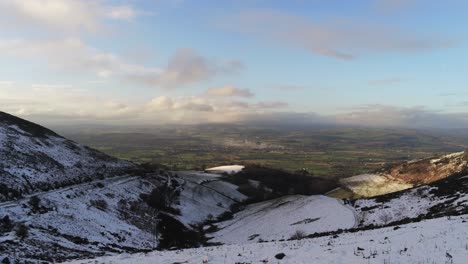 Moel-Famau-Welsh-snowy-mountain-valley-aerial-view-cold-agricultural-rural-winter-countryside
