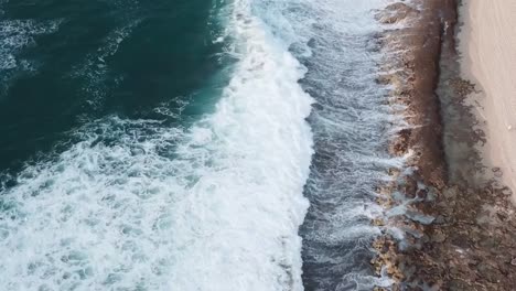 Drone-aerial-beach-waves-forests-pan-up-Hawaii