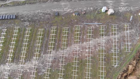 Wide-aerial-view-of-a-solar-farm-under-construction-with-some-finished-panels-and-others-with-just-the-frame