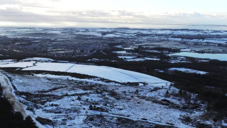 Snowy-winter-patchwork-Lancashire-farmland-rural-countryside-landscape-panning-right