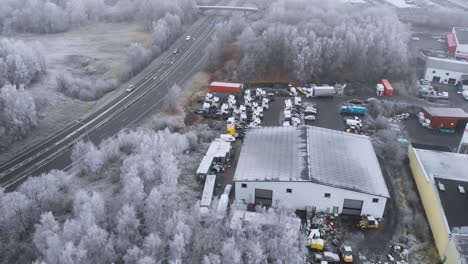 Industrial-Storage-Warehouse-in-Wintertime---Aerial-Orbit