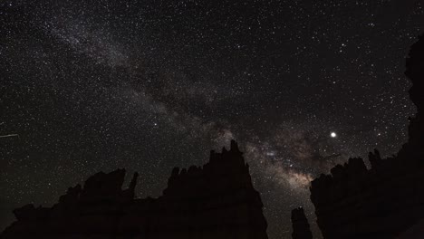 Timelapse-of-beautiful-Milky-way-galaxy-moving-across-the-sky-with-silhouette-of-unique-geological-formations-in-Bryce-Canyon-National-Park,-Utah-United-States