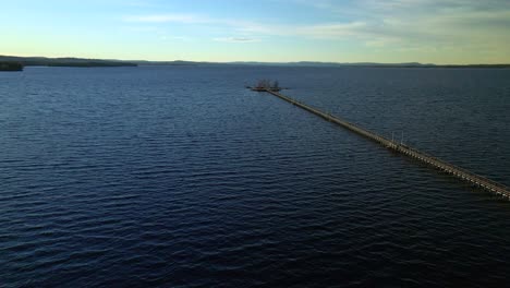 Flying-Along-Walking-Bridge-and-Viewing-Deck,-Middle-of-the-Lake,-Forward-Aerial