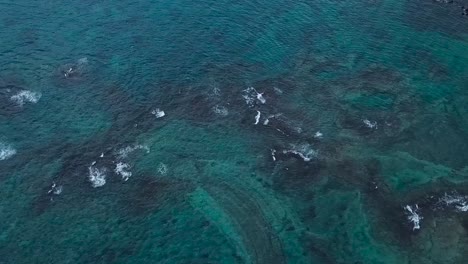 Drone-aerial-beach-pan-up-ocean-Hawaii