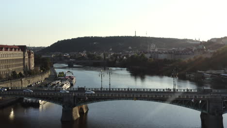 Aerial-Shot-Of-Bridge-Over-Vltava-River-And-Prague-Castle-At-Sunset,-Czech-Republic