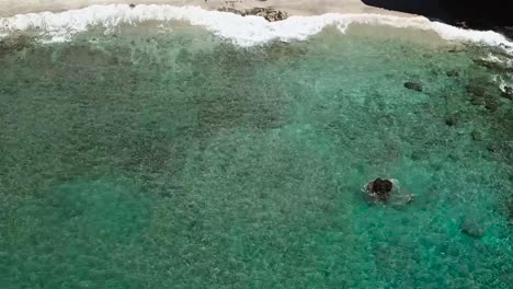 Drone-aerial-clear-blue-water-pan-down-summer-Hawaii
