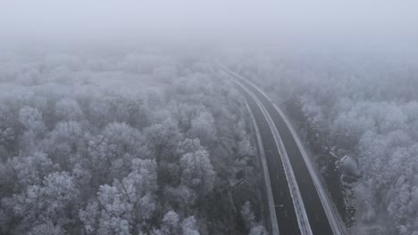 Foggy,-Snowy-Weather-in-Freezing-Nordic-Country-of-Sweden---Aerial