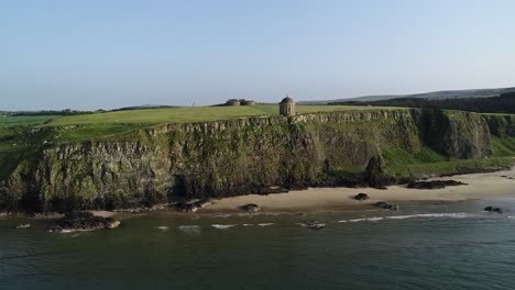 Aerial-View-of-Historic-Landmark-on-Cliff-Above-Atlantic-Ocean,-Mussenden-Temple-and-Downhill-Demesne-Estate,-Northern-Ireland-UK,-60fps-Drone-Shot