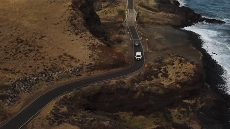 Drone-aerial-windy-road-cars-beach-cliff-side
