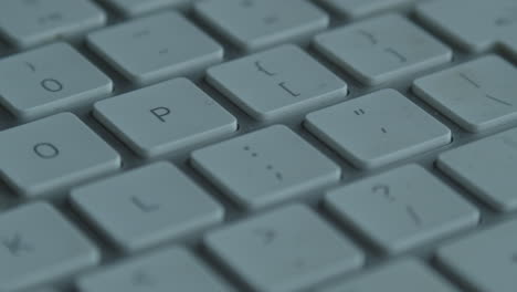 Slider-view-along-dim-white-keys-on-computer-keyboard,-macro