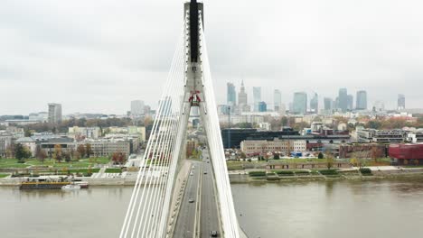 Aerial-View-of-Suspension-Bridge-with-Warsaw-Cityscape,-capital-of-Poland