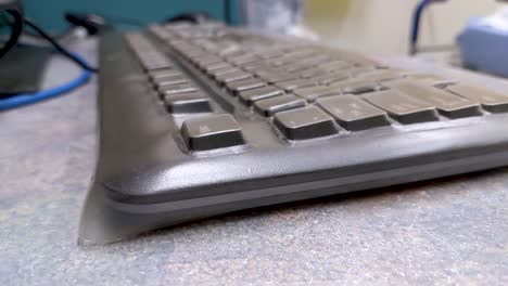 Close-up-slow-pan-over-a-hospital-office-keyboard