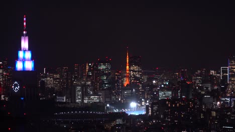 Slow-left-to-right-pan-across-night-cityscape-with-Shinjuku-and-Tokyo-Tower