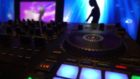 video-dj-controller-4-channels-video-3-screens-flashing-preset-buttons-with-sihouette-shadow-gogo-dancers-dancing-in-front-of-night-club-guests-and-entertainer-resampling-the-audio-visual-effects-2-4